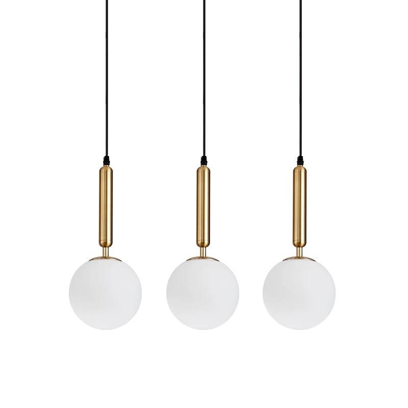 Lustra suspendata cu 3 globuri sticla alba mata, suport metalic auriu, soclu E27, max 60W