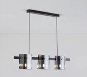 Lustra suspendata cu 3 abajururi cilindrice din sticla fumata, structura neagra mata, soclu G9, bara 800 mm