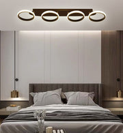 Lustra LED 88W cu 4 inele negru-auriu, montaj tavan, lumina reglabila 3000K-6500K, telecomanda WiFi, dormitor modern